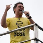 Flávio Bolsonaro rides right-wing wave to win first round of Brazil election