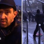 Fireworks and tear gas as protesters and riot police clash in Paris