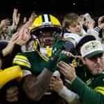 Love throws 3 TD passes as the Packers beat the Panthers 27-19