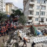 A partial building collapse in Istanbul kills 2 and traps at least 2 more