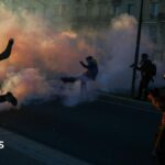 Clashes erupt between police and protesters in Paris